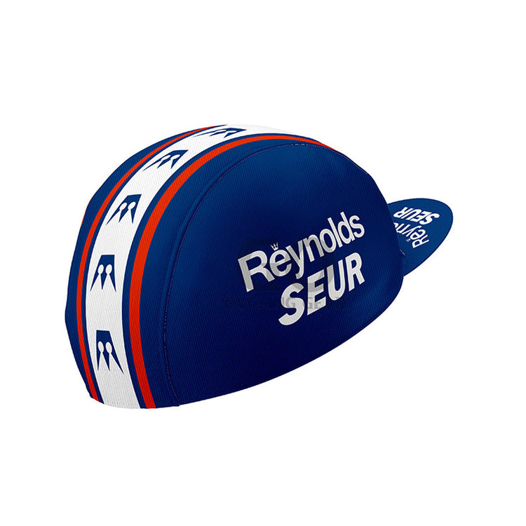 Blue and white cycling cap with 'Reynolds SEUR' branding on a white background