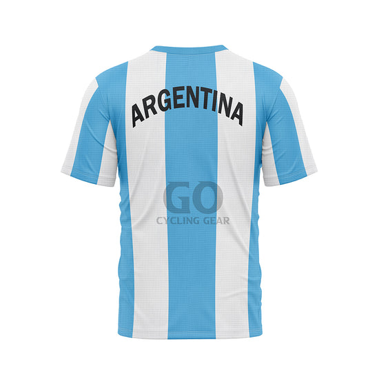Back view of a T-shirt with vertical light blue and white stripes. 'ARGENTINA' is written in prominent black capital letters across the upper back. The T-shirt has a light blue ribbed collar