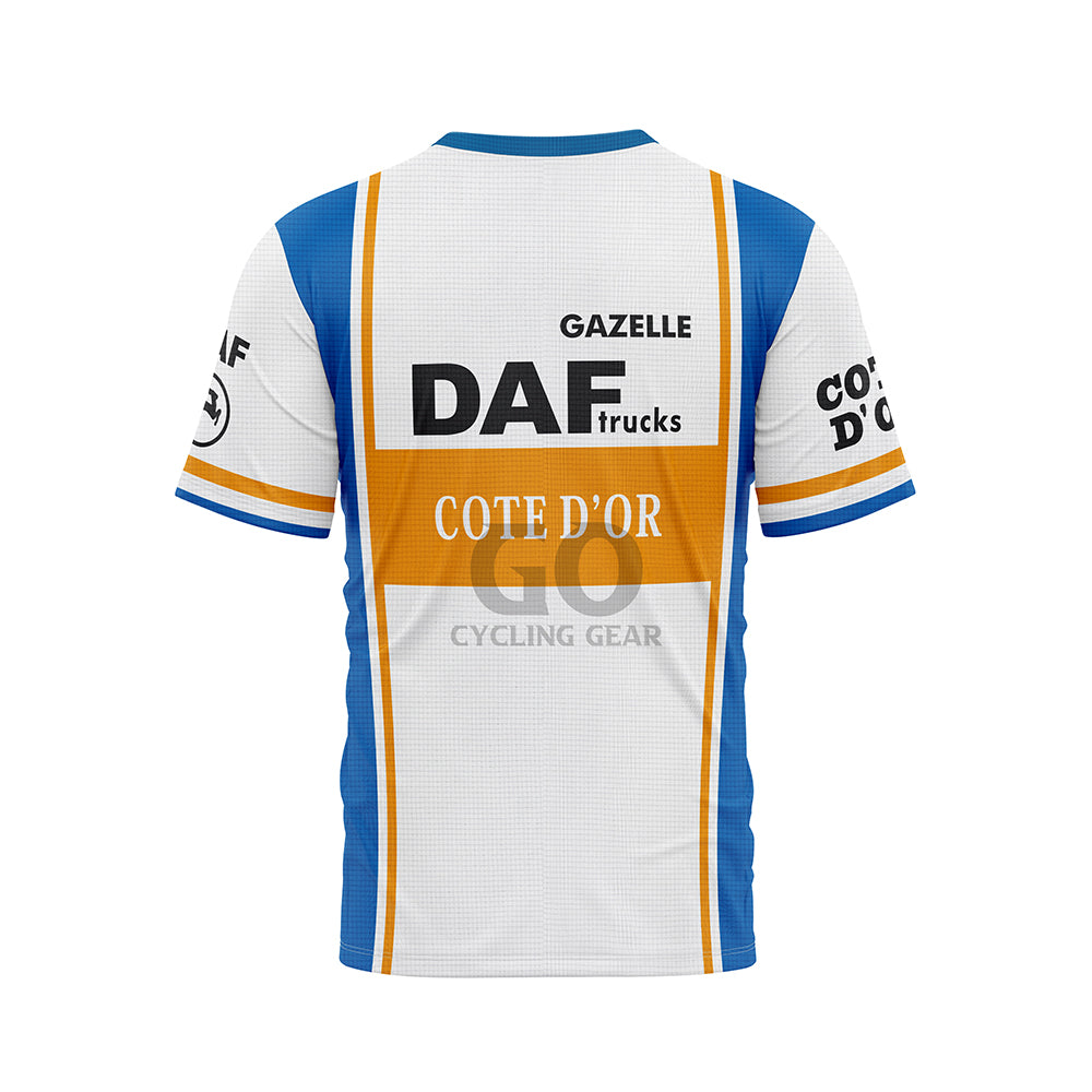 Back view of a white, blue, and orange T-shirt. A large 'DAF trucks' logo and 'COTE D'OR' are centered on the back, with 'GAZELLE' above. Blue side panels and sleeve details are visible. Sleeves also show 'COTE D'OR' text