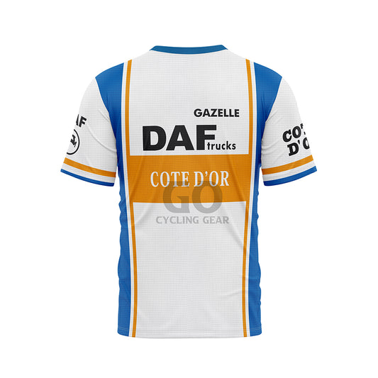 Back view of a white, blue, and orange T-shirt. A large 'DAF trucks' logo and 'COTE D'OR' are centered on the back, with 'GAZELLE' above. Blue side panels and sleeve details are visible. Sleeves also show 'COTE D'OR' text
