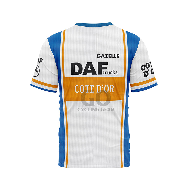 Back view of a white, blue, and orange T-shirt. A large 'DAF trucks' logo and 'COTE D'OR' are centered on the back, with 'GAZELLE' above. Blue side panels and sleeve details are visible. Sleeves also show 'COTE D'OR' text