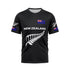 Front view of a black T-shirt featuring 'NEW ZEALAND' in white text across the chest, accompanied by a large white silver fern graphic below. A New Zealand flag is positioned on the upper right chest, and smaller silver ferns and flags are on both sleeves.