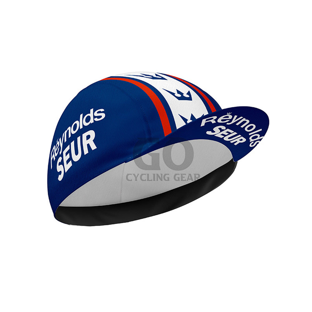 Blue and white cycling cap with 'Reynolds Seur' branding on a white background