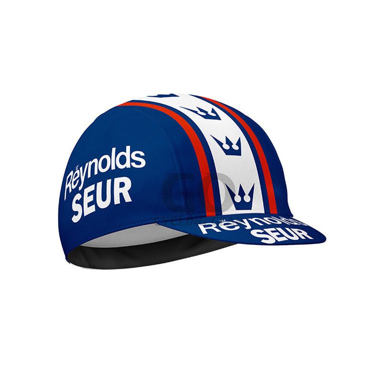 Blue cycling cap with 'Reynolds Seur' branding on a white background