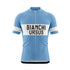 Front view of a light blue short-sleeved cycling jersey with a full-length zipper. A wide white horizontal band across the chest features "BIANCHI" in large black capitalized letters, with "URSUS" in black capitalized letters directly below it. The sleeves have white bands with "BIANCHI" in black text.